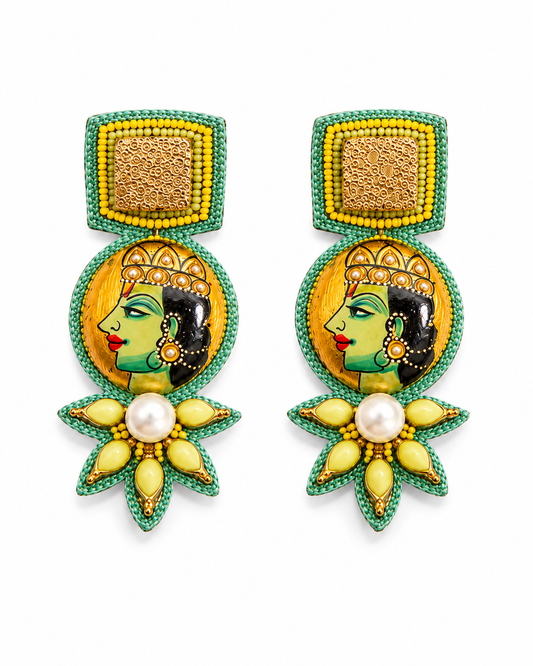 Neha Sharma Label Royal Nougat painted portrait drop earrings with green cord and yellow petal stones.