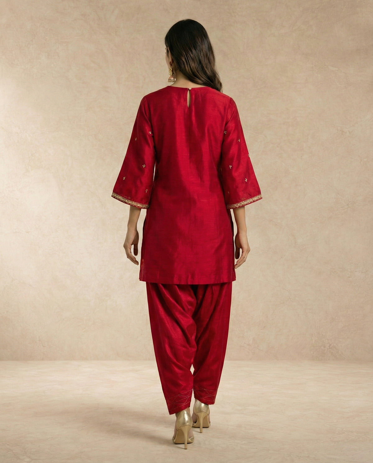 FARHEEN crimson silk kurta with gold sprig butis and draped salwar by Neha Sharma Label.