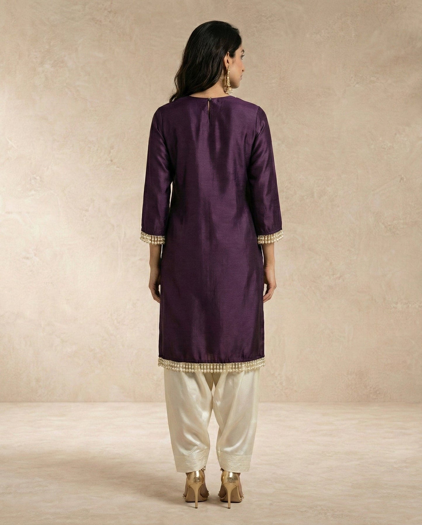 SABA plum raw silk kurta with pearl drop sleeve cuffs and side slits by Neha Sharma Label.