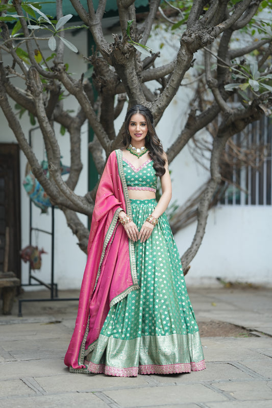 golden zari buti work on the Emerald Opulence Green Banarasi Lehenga