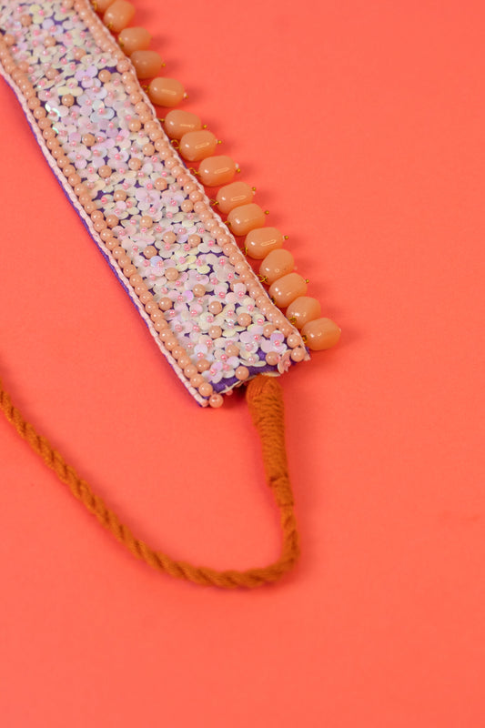 Sequins beaded choker with pearl drop .