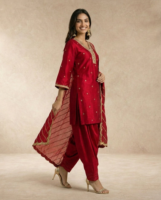 Neha Sharma Label FARHEEN crimson silk kurta salwar set with gold embroidered neckline.
