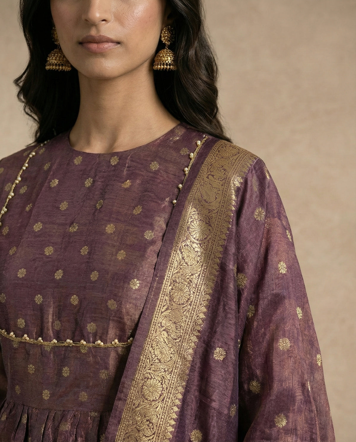Woven gold zari butis on the ANAYA mauve banarasi silk anarkali by Neha Sharma Label.