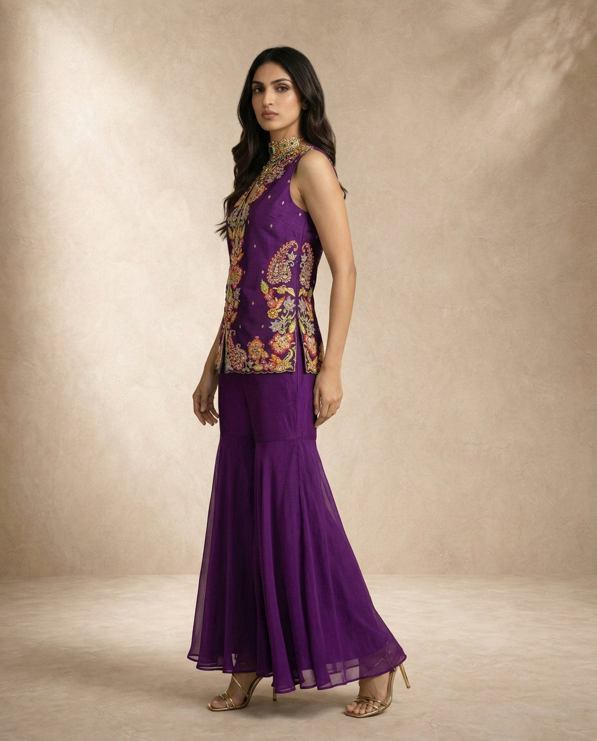 HIYA purple silk top with scalloped embroidered placket and gharara by Neha Sharma Label.