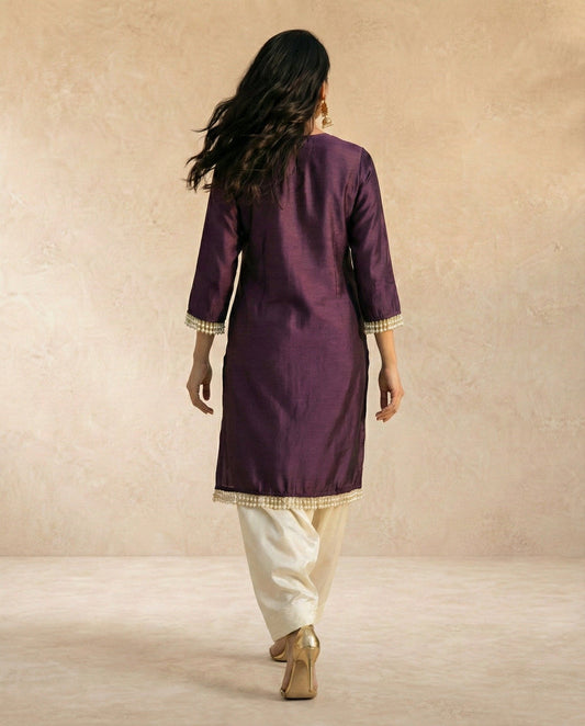 SABA plum raw silk kurta with gold centre panel and pearl drop trim by Neha Sharma Label.