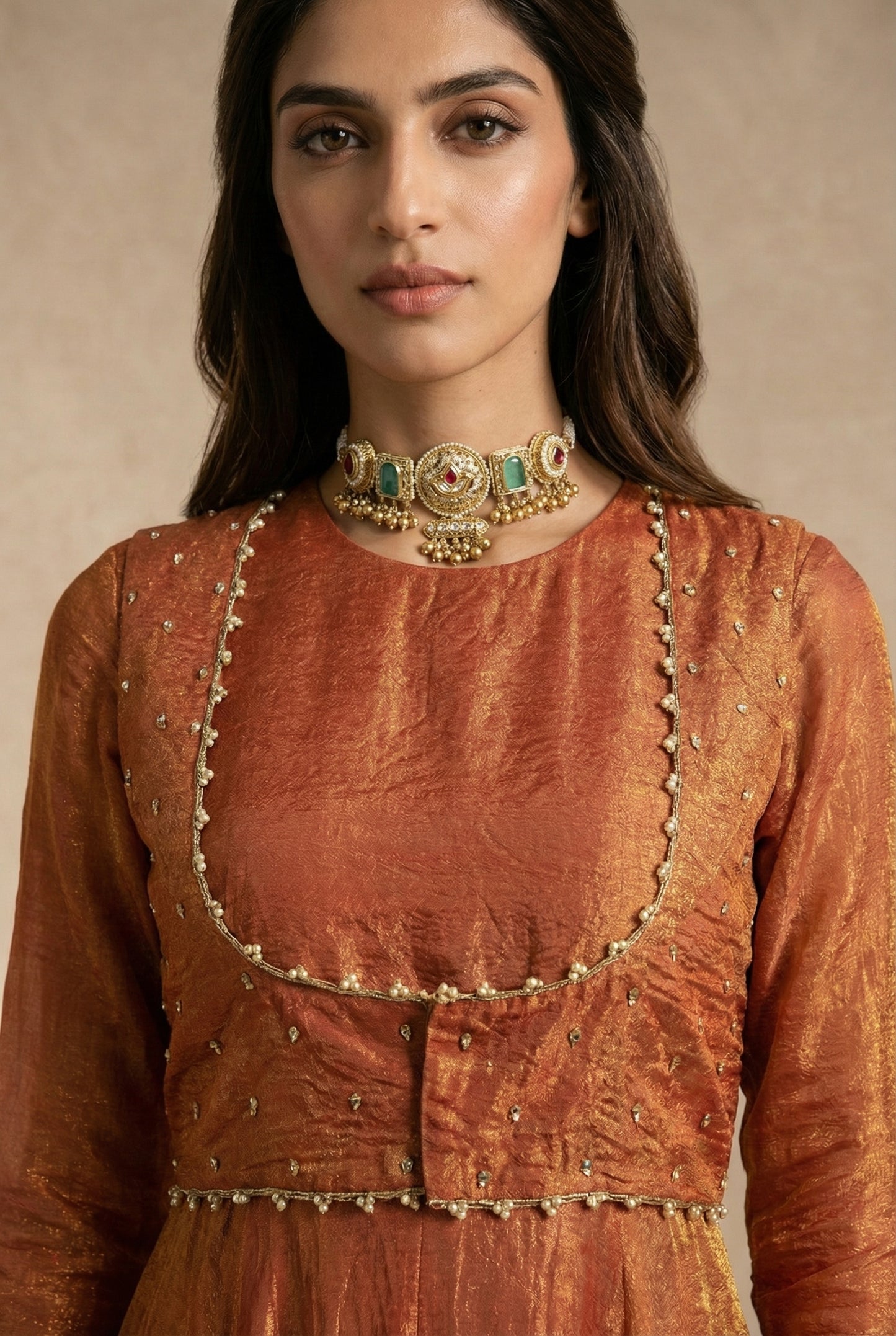 AMAIRA terracotta anarkali with pearl-edged sleeveless jacket by Neha Sharma Label.