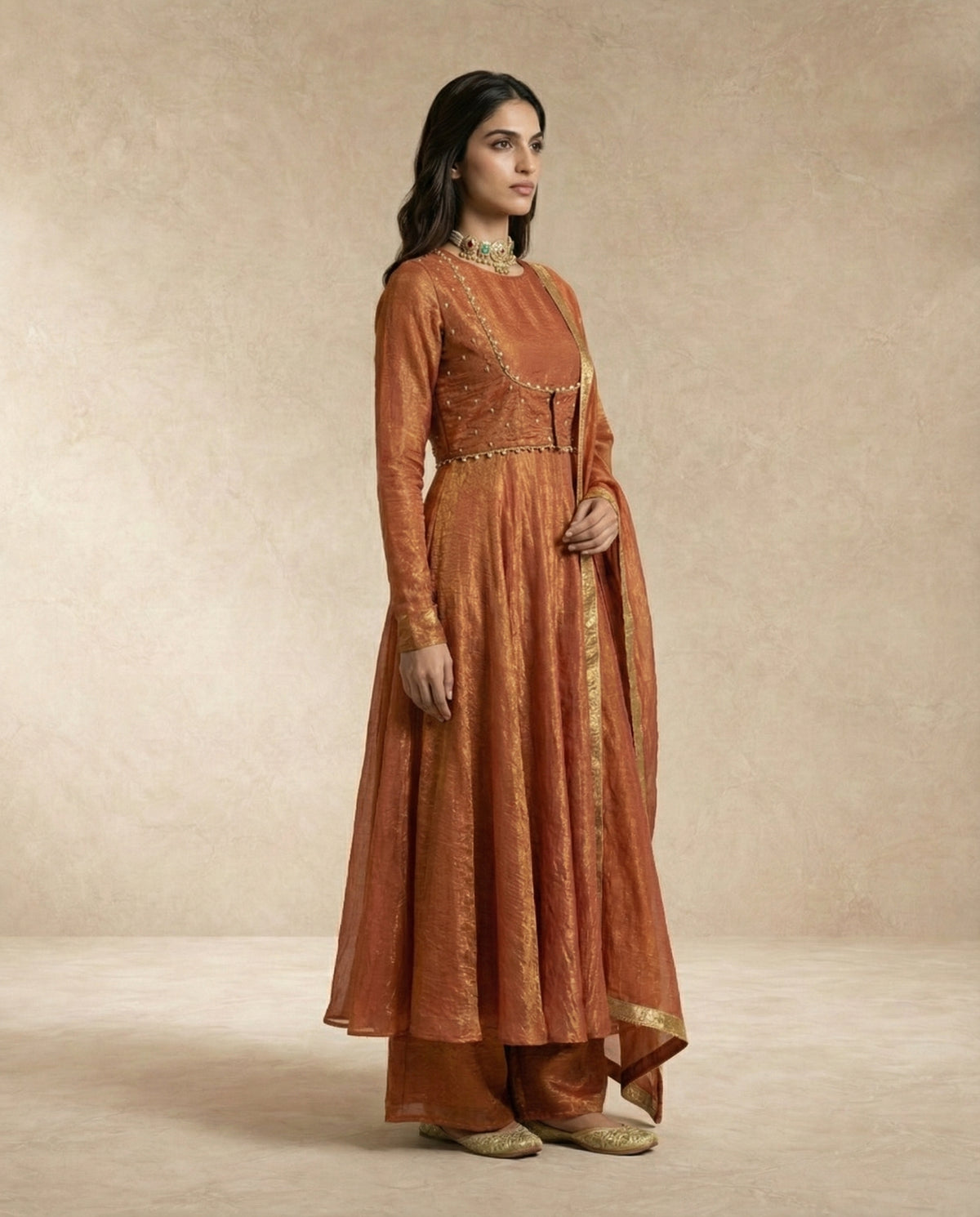 AMAIRA terracotta crushed silk anarkali set with palazzo pants by Neha Sharma Label.