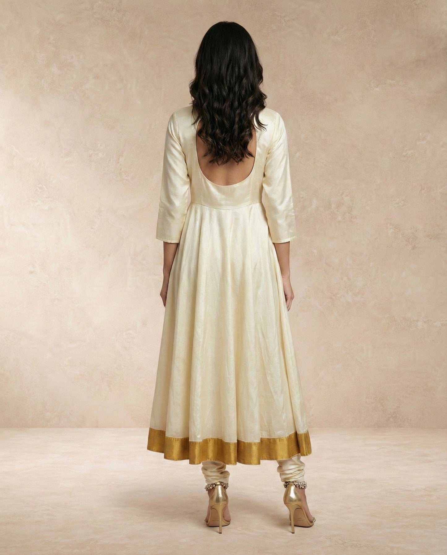 Back drape of the sheer gold-edged organza dupatta on the ANJUM anarkali set by Neha Sharma Label.