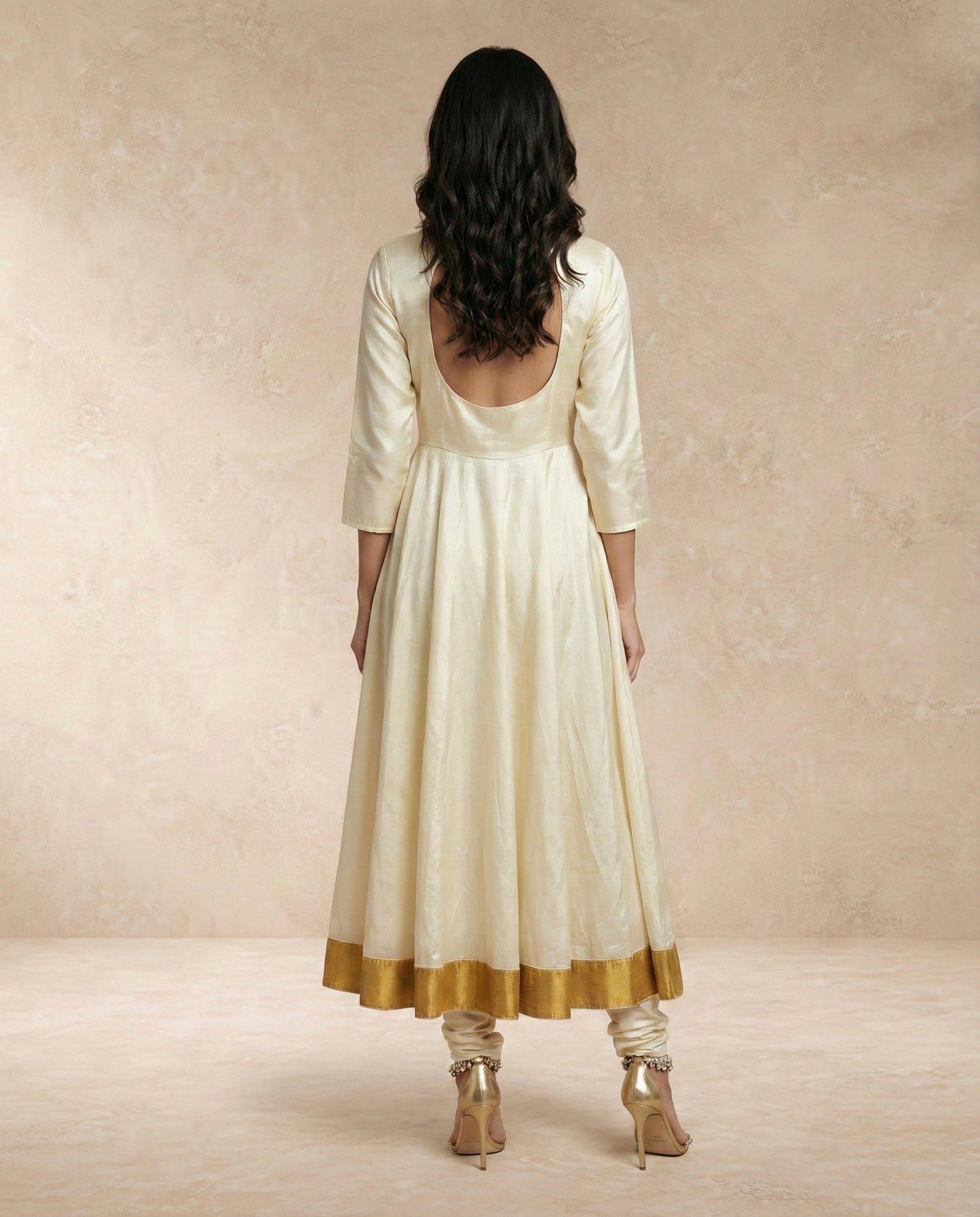 Back drape of the sheer gold-edged organza dupatta on the ANJUM anarkali set by Neha Sharma Label.
