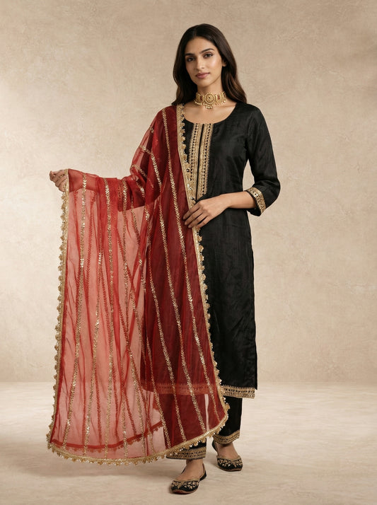 Front view of the NOORI kurta set with the gold embroidered red tissue dupatta held open.
