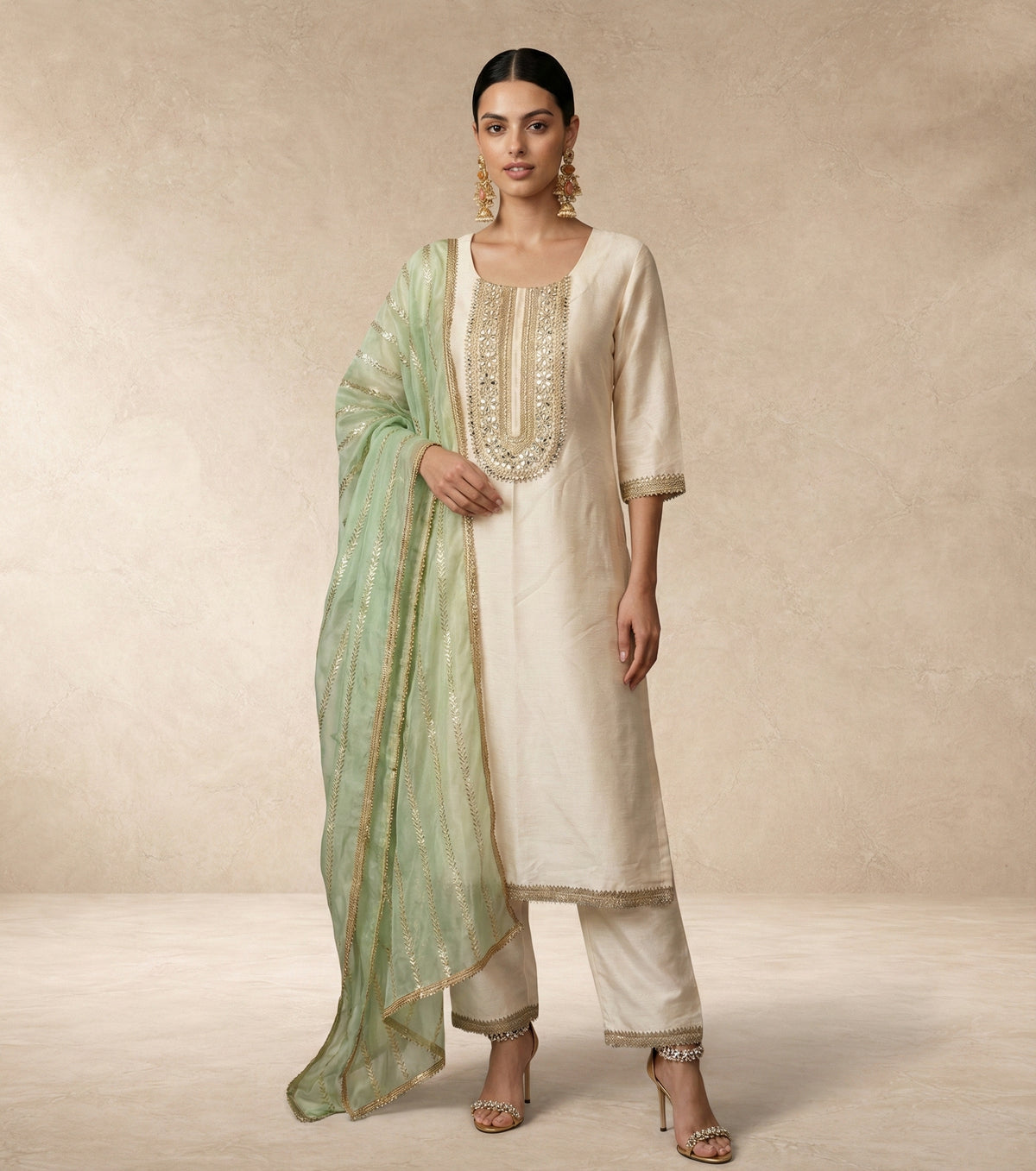 AFREEN ivory kurta with mirror and pearl embroidered neckline panel by Neha Sharma Label.
