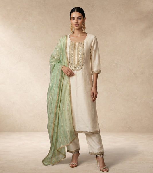 AFREEN ivory kurta with mirror and pearl embroidered neckline panel by Neha Sharma Label.