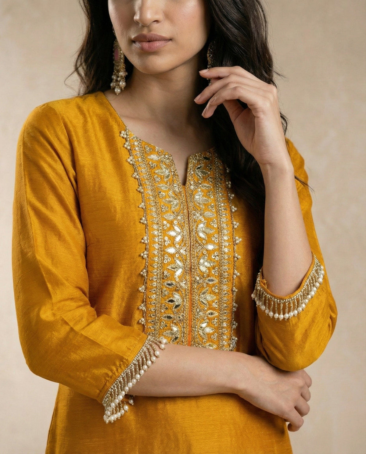 Close view of the HINA yoke embroidery and pearl-bead sleeve fringe by Neha Sharma Label.
