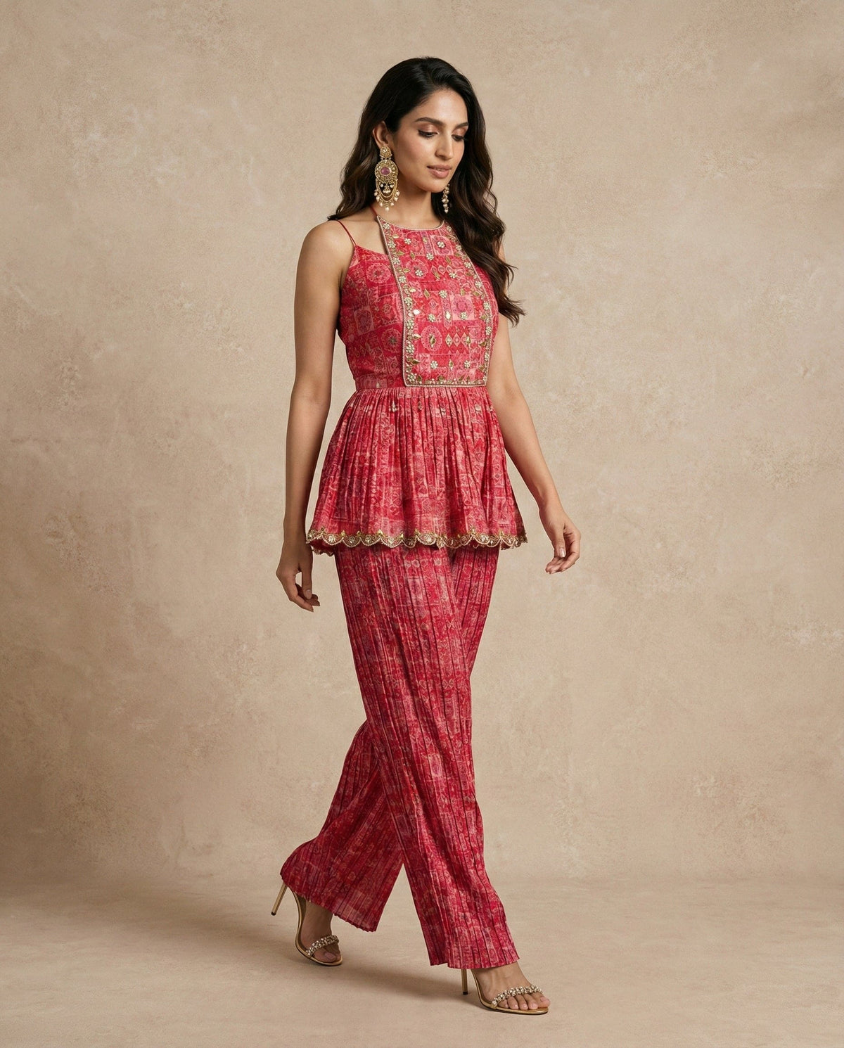 FALAK rosewood peplum kurta with tie-up straps and tassels by Neha Sharma Label.