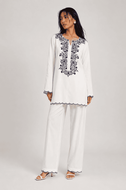 Neha Sharma Label SUNSPELL white pure cotton kurta set with navy floral embroidery.