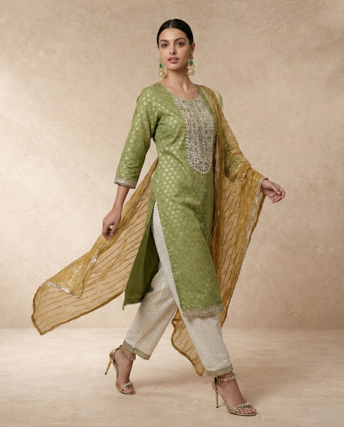 ZUBAIDA olive green banarasi kurta with woven gold butis and lace borders by Neha Sharma Label.
