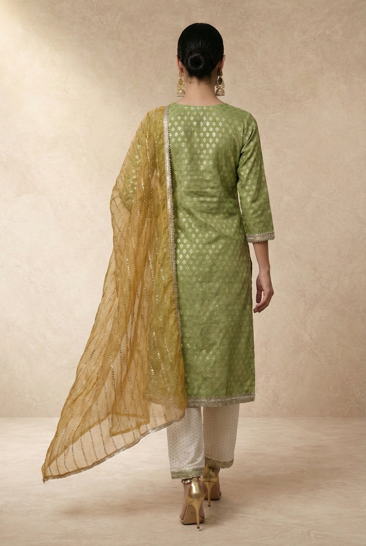 ZUBAIDA gold tissue dupatta with diagonal sequin stripes and gold lace border by Neha Sharma Label.