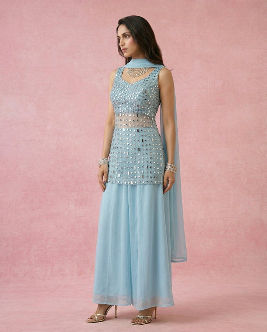 Neha Sharma Label MAHTAB powder blue sheer georgette mirror work sharara set with short kurta.