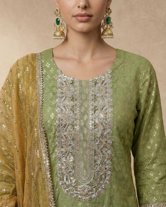 ZUBAIDA olive green kurta with mirror and sequin embroidered neckline panel by Neha Sharma Label.
