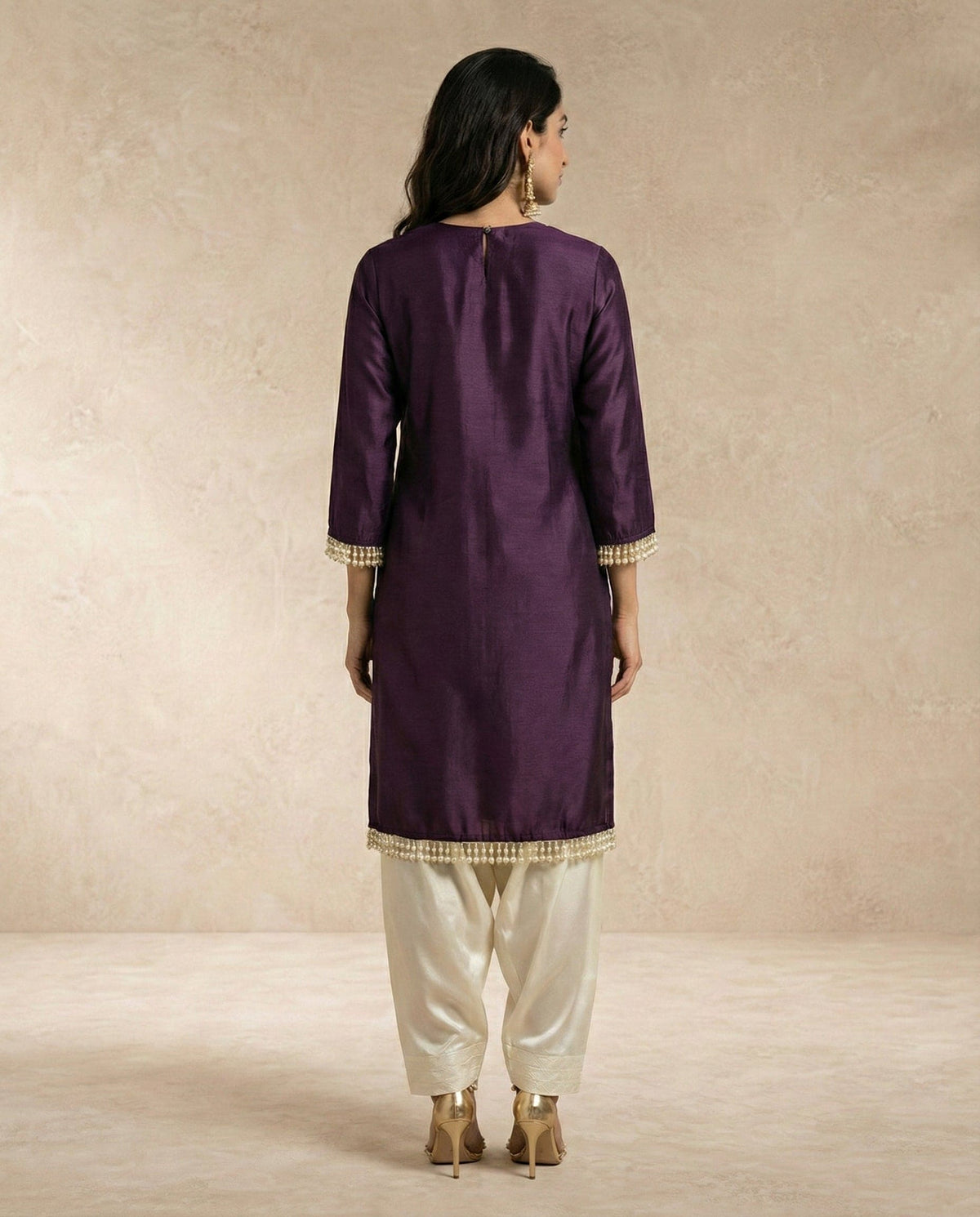 SABA plum raw silk kurta with pearl drop sleeve cuffs and side slits by Neha Sharma Label.
