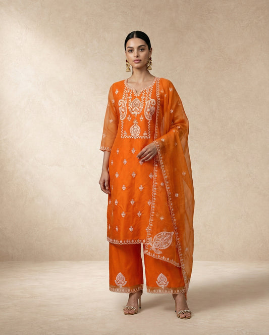 IFRA marigold orange sheer organza kurta with palazzo pants by Neha Sharma Label.
