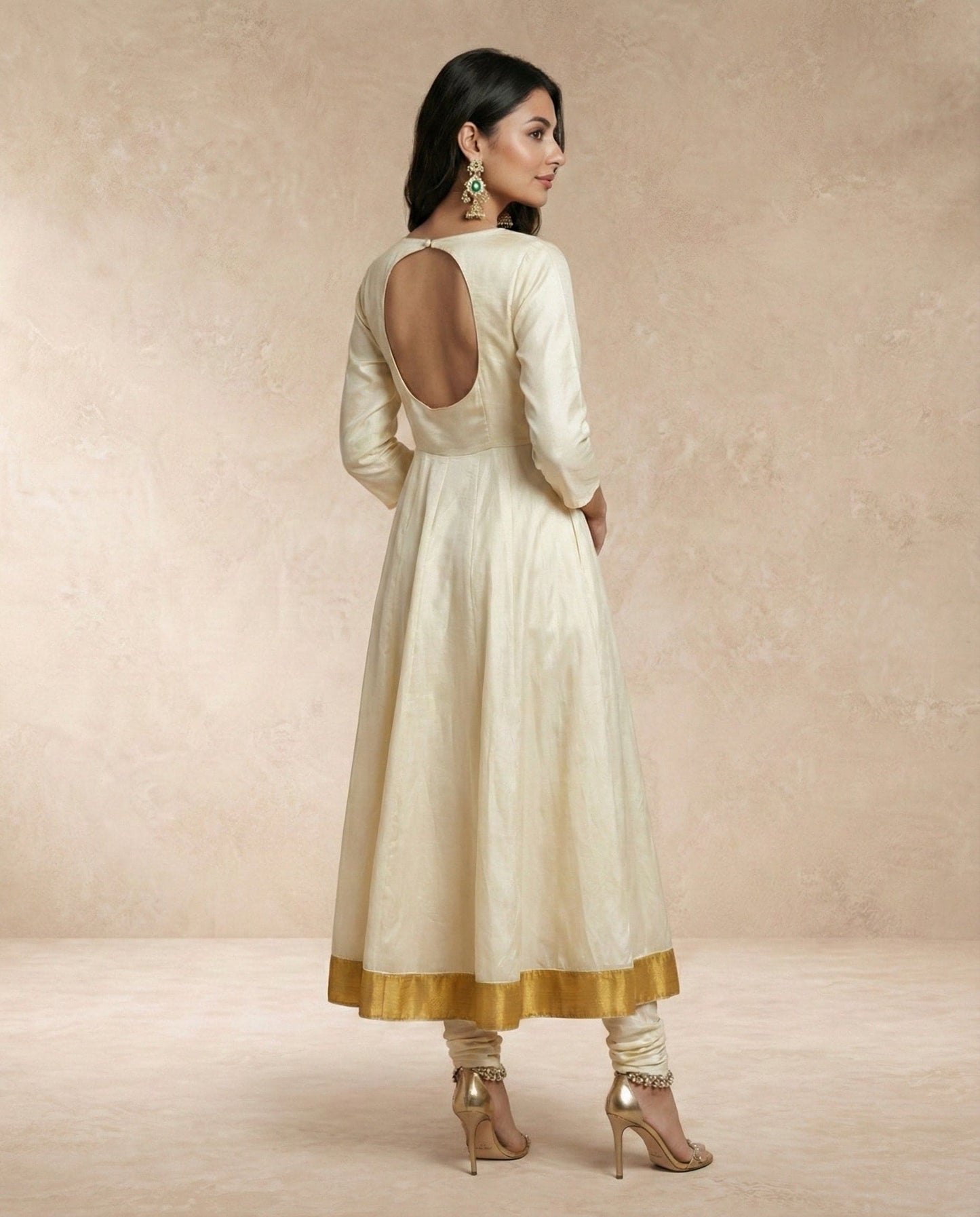 Keyhole open back with button closure on the ANJUM ivory silk anarkali by Neha Sharma Label.