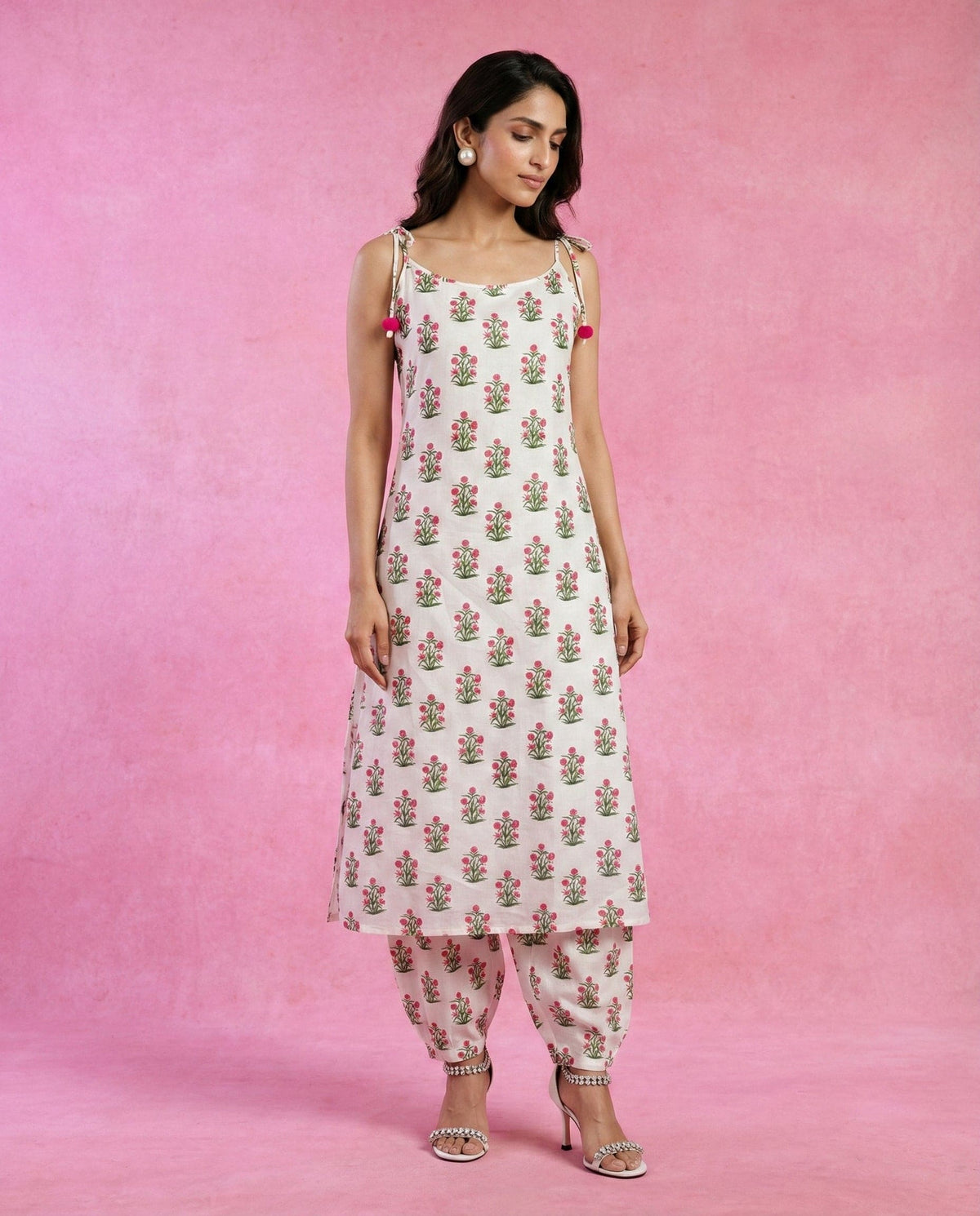 HOOR white floral printed kurta set with matching straight pants by Neha Sharma Label.