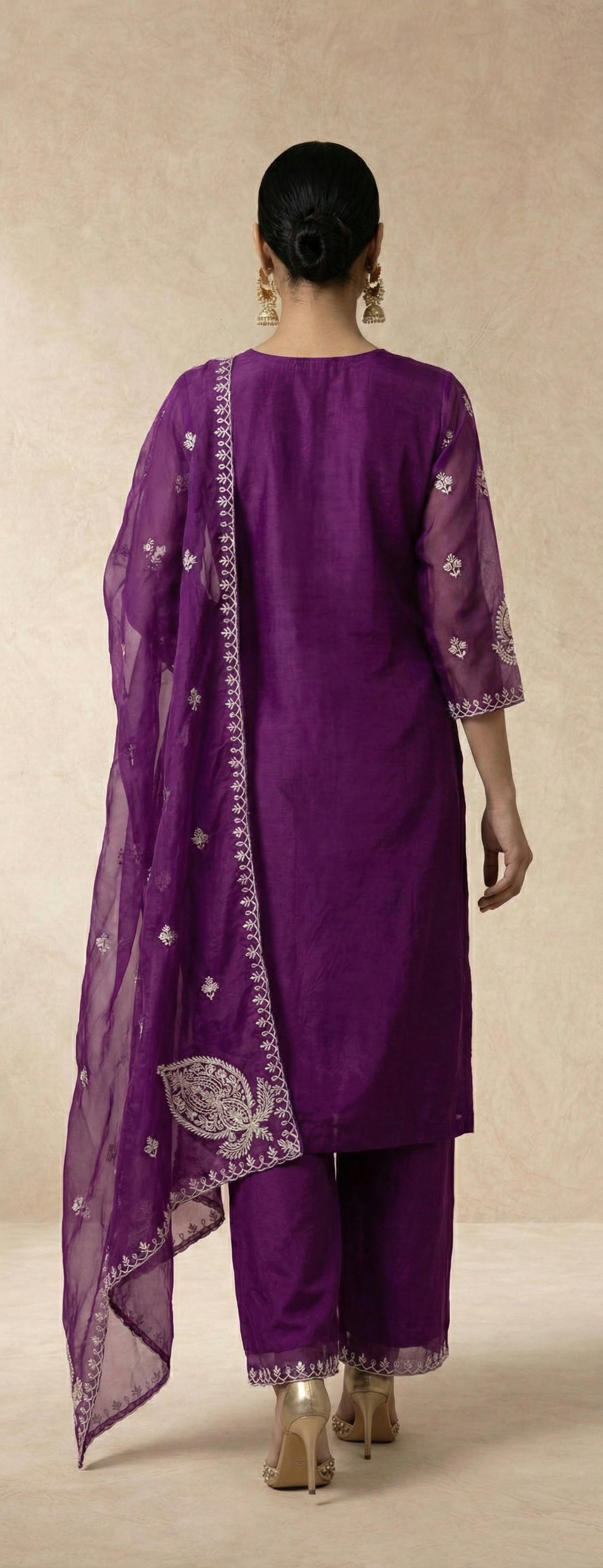 Ivory thread embroidery on the AFSHEEN purple organza kurta by Neha Sharma Label.