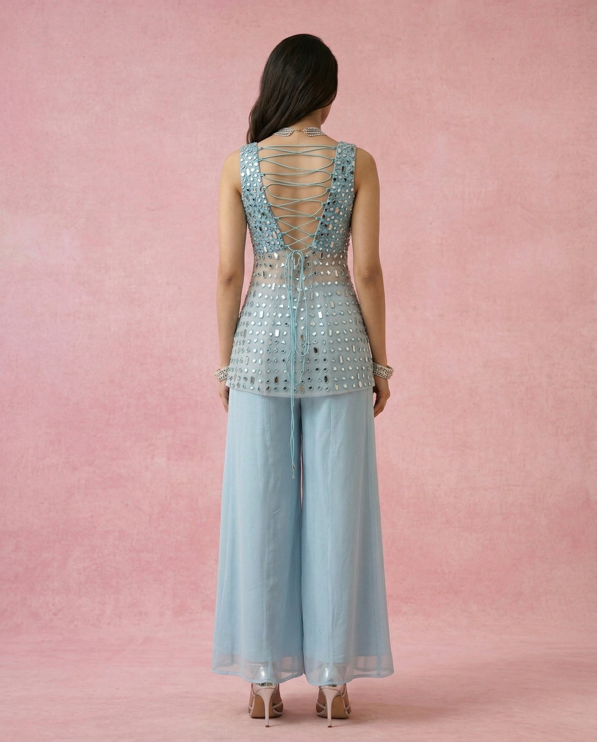 Criss-cross dori tie-up back with hanging tie tails on the MAHTAB powder blue mirror work kurta.