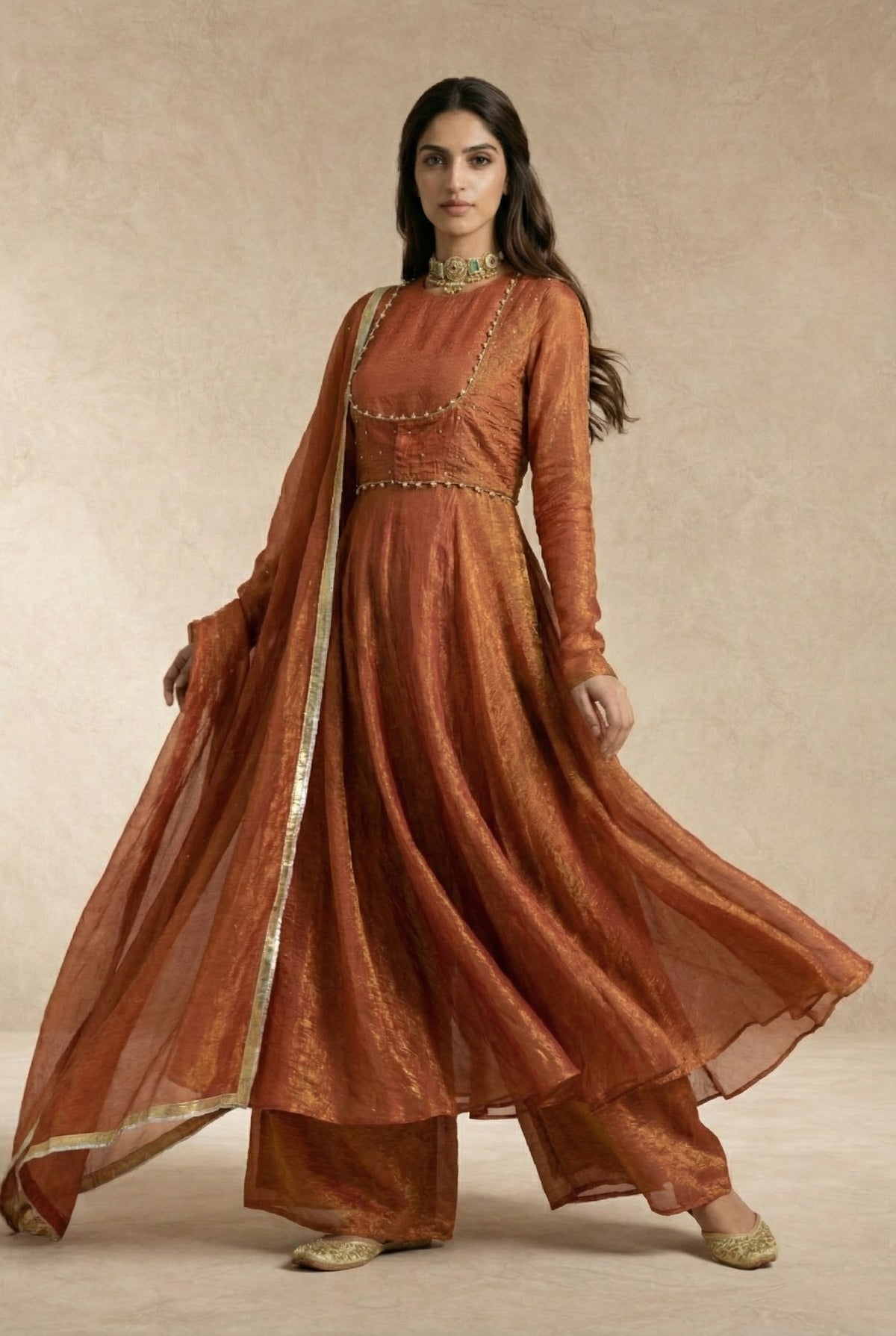 AMAIRA terracotta anarkali set styled with antique gold jewellery by Neha Sharma Label.