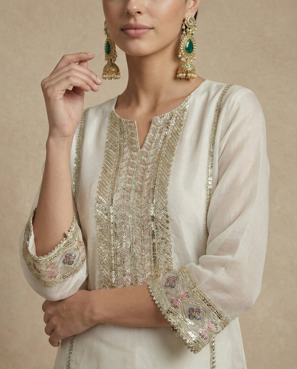 KISHWAR ivory kurta and full-flare sharara with scalloped floral arch border, front view without dupatta.