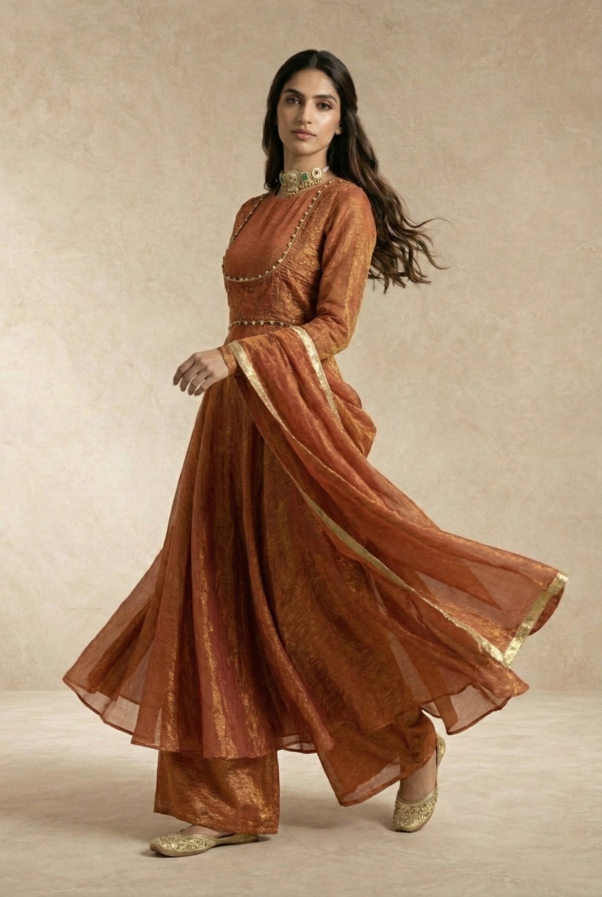 AMAIRA terracotta anarkali and jacket set with flowing dupatta by Neha Sharma Label.