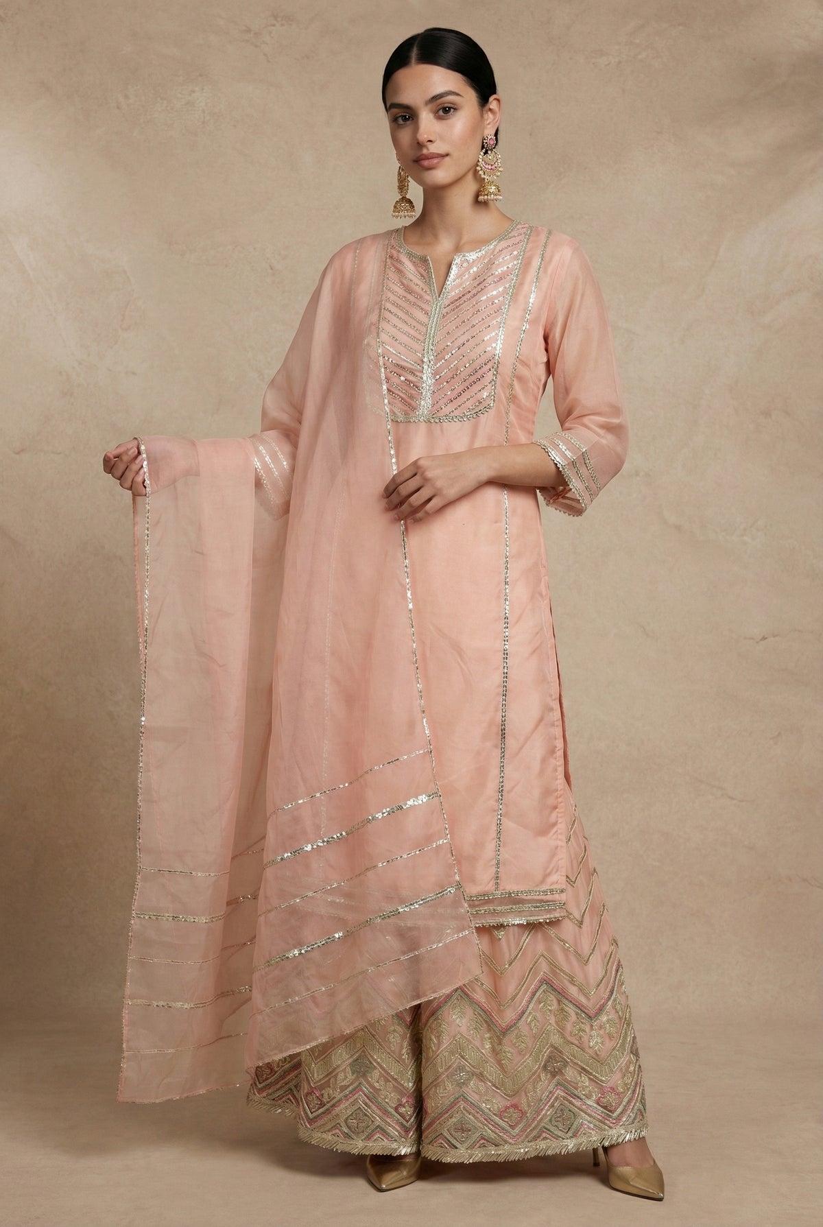 Neha Sharma Label ZEENAT peach organza sharara set, front view with the sheer dupatta draped over one shoulder.