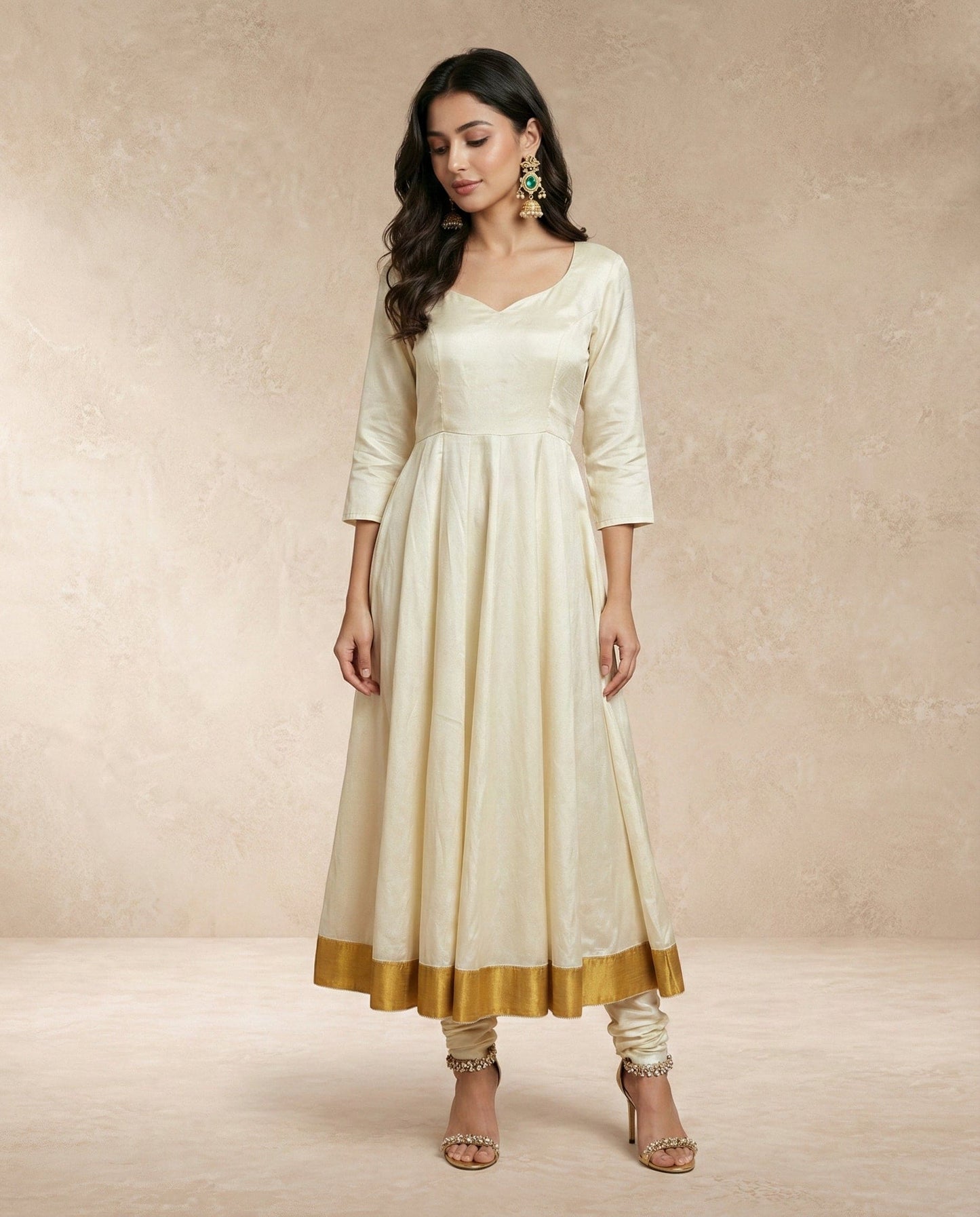 Sweetheart neckline and three-quarter sleeves of the ANJUM ivory silk anarkali by Neha Sharma Label.