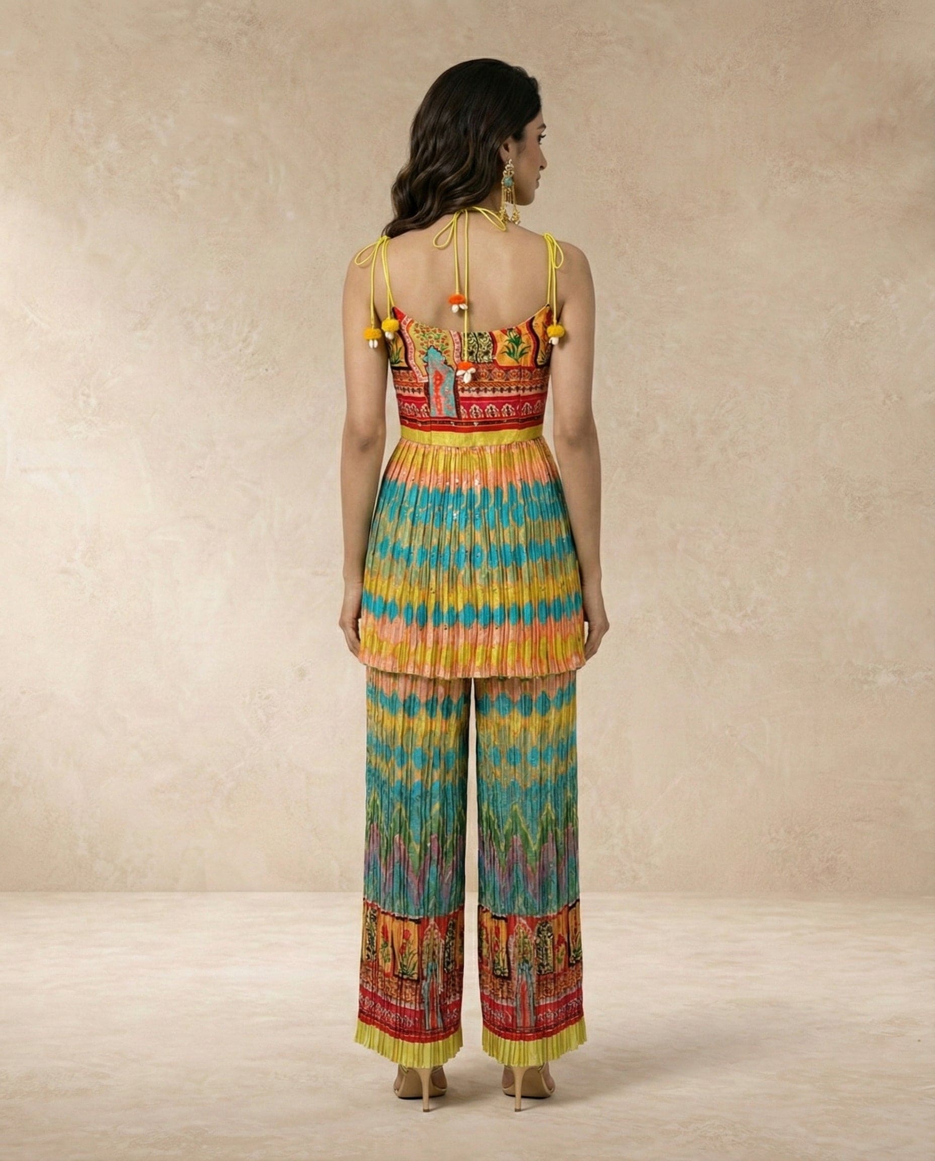 Back view of the SAFI flap kurta set showing the tie-up shoulders and pom pom trims.