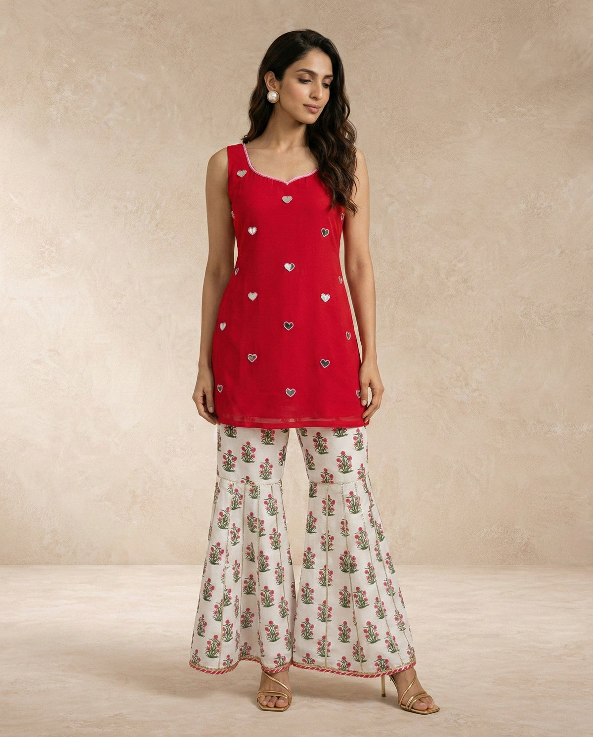 SANA red mirror work kurti and floral printed gharara with gota-edged dupatta.