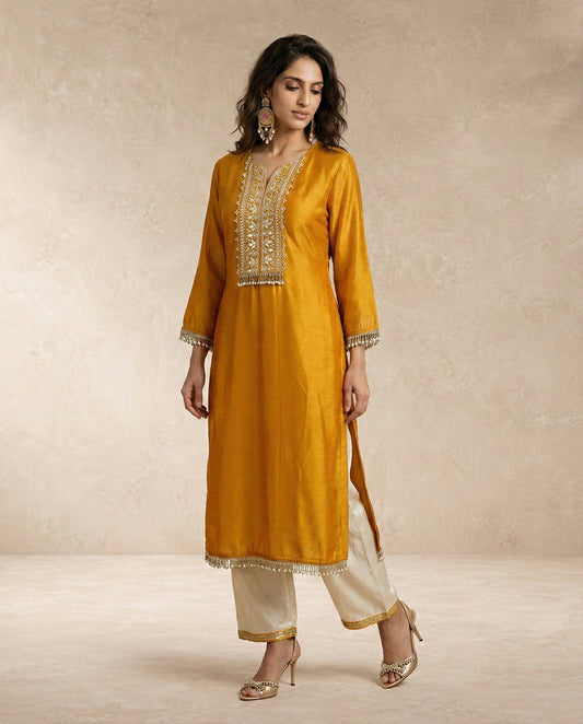 Neha Sharma Label HINA mustard gold silk kurta set with cream parallel pants and organza dupatta.