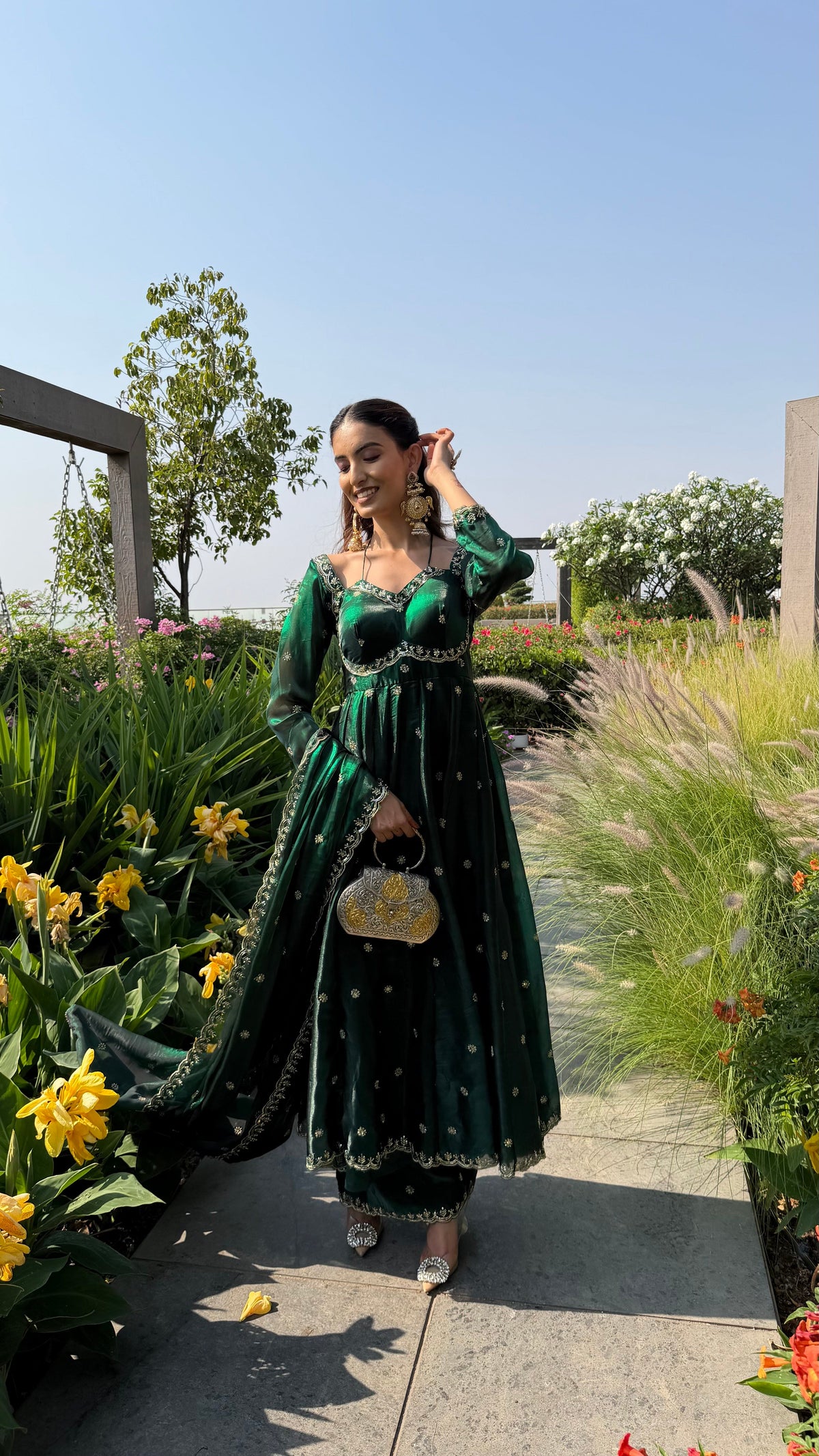 YASMIN bottle green anarkali set styled with gold jewellery by Neha Sharma Label.