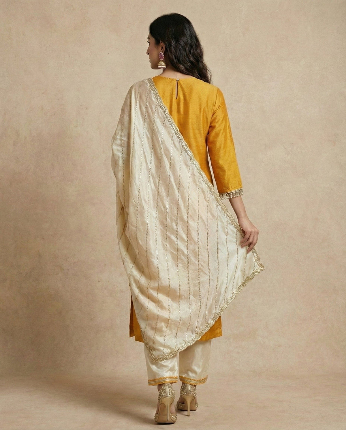 Back of the HINA mustard gold silk kurta with keyhole button nape by Neha Sharma Label.