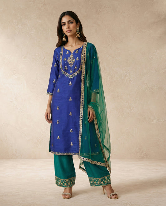 Neha Sharma Label FIROZA royal blue raw silk kurta set with teal pants and teal net dupatta.