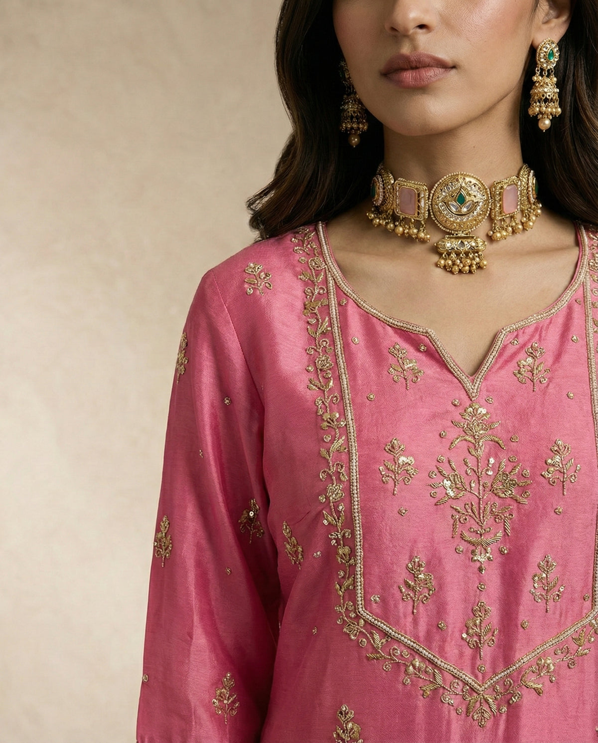 Pearl-bead outlined yoke with gold floral sprays on the HANIYA pink kurta by Neha Sharma Label.