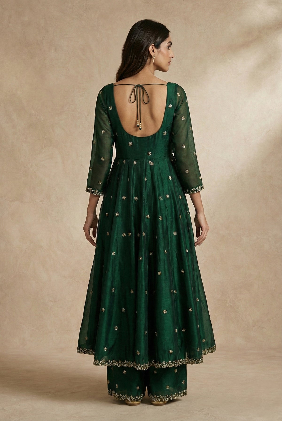 Scalloped embroidered cuffs on the YASMIN bottle green silk organza anarkali by Neha Sharma Label.