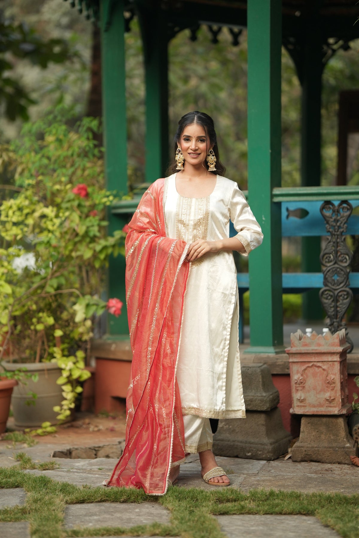 The embroidered neckline and centre placket of the ARTISAN'S MOTIF off white kurta.