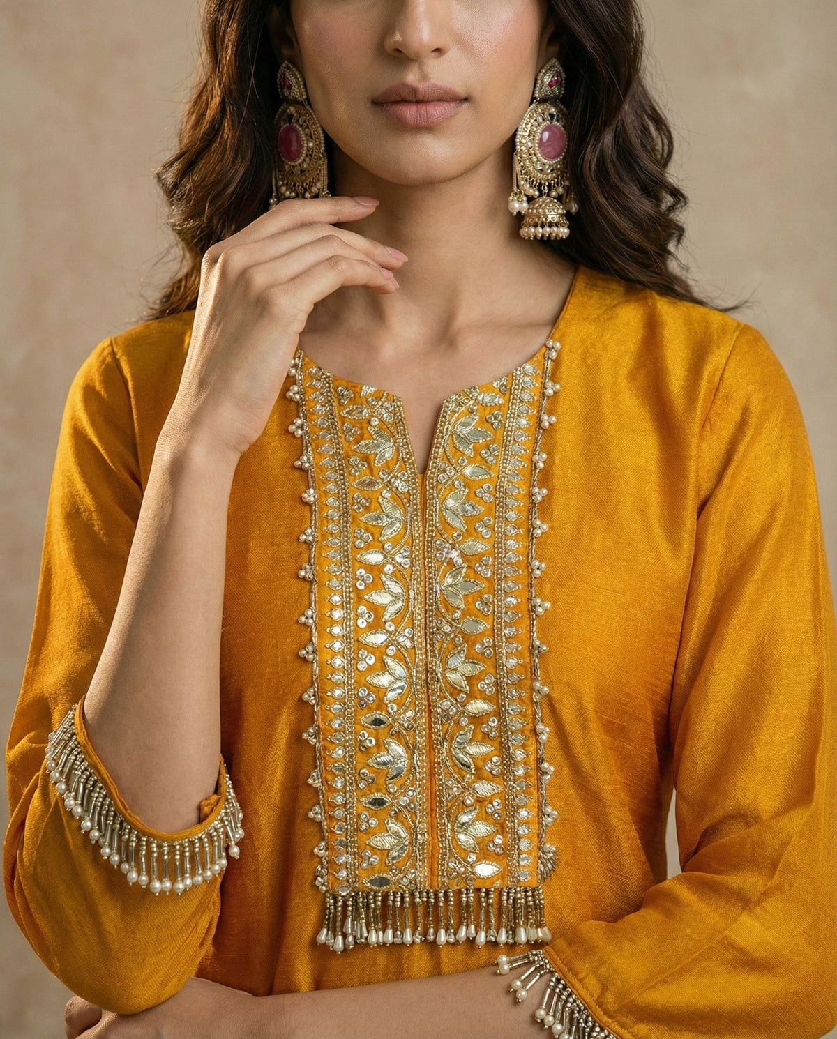 Embroidered yoke with gold-toned thread, mirror work and pearl-bead fringe on the HINA kurta by Neha Sharma Label.
