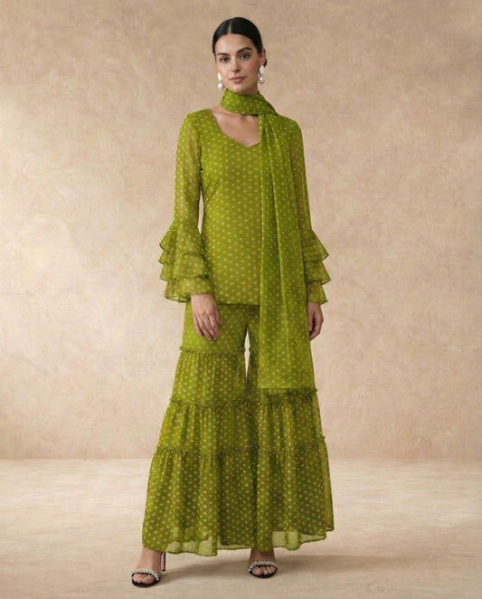 NAVYA mehendi green bandhani print georgette sharara set with sweetheart neck and ruffle bell sleeves.