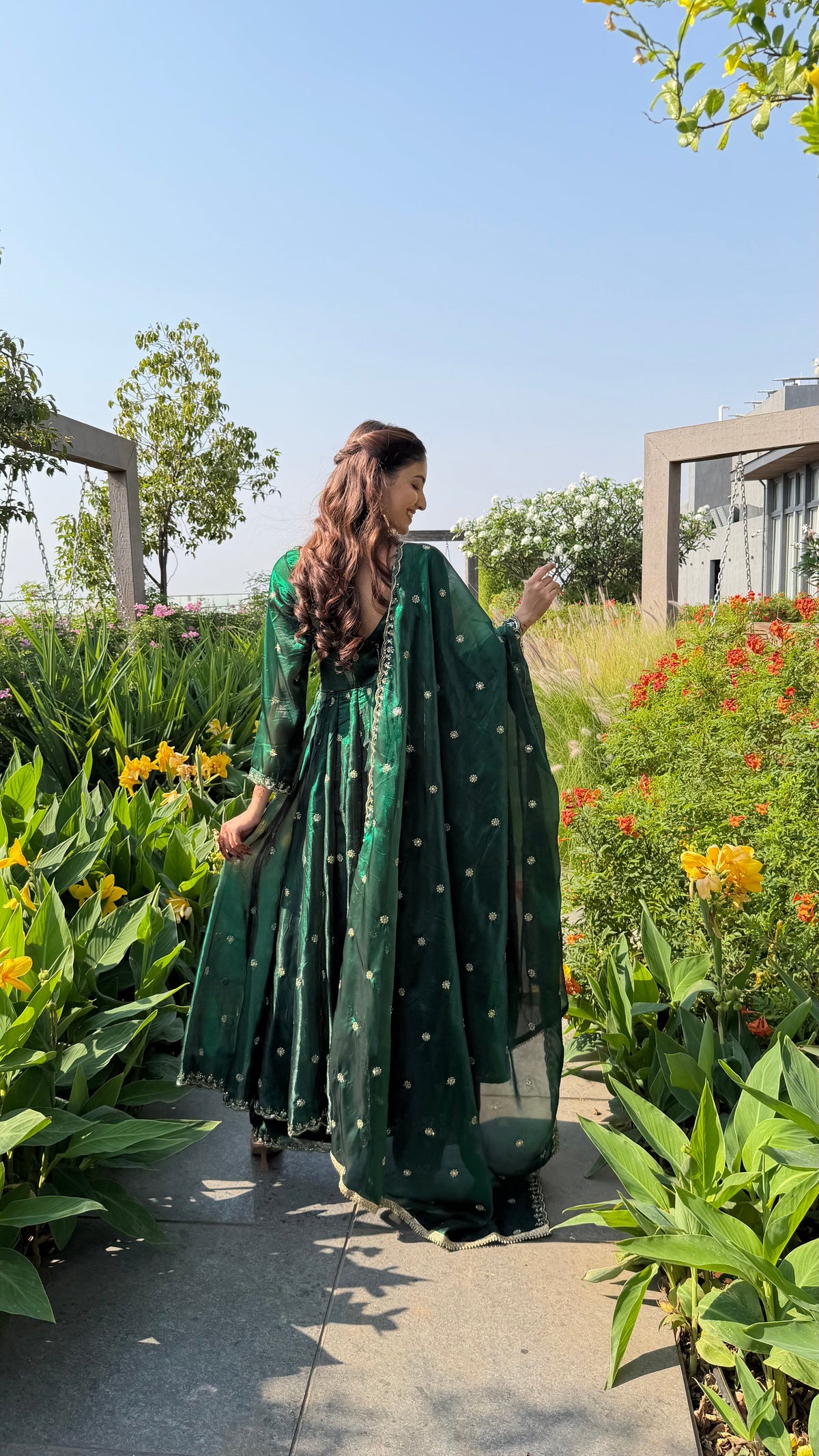 Gold embroidered borders on the YASMIN bottle green anarkali and pants by Neha Sharma Label.