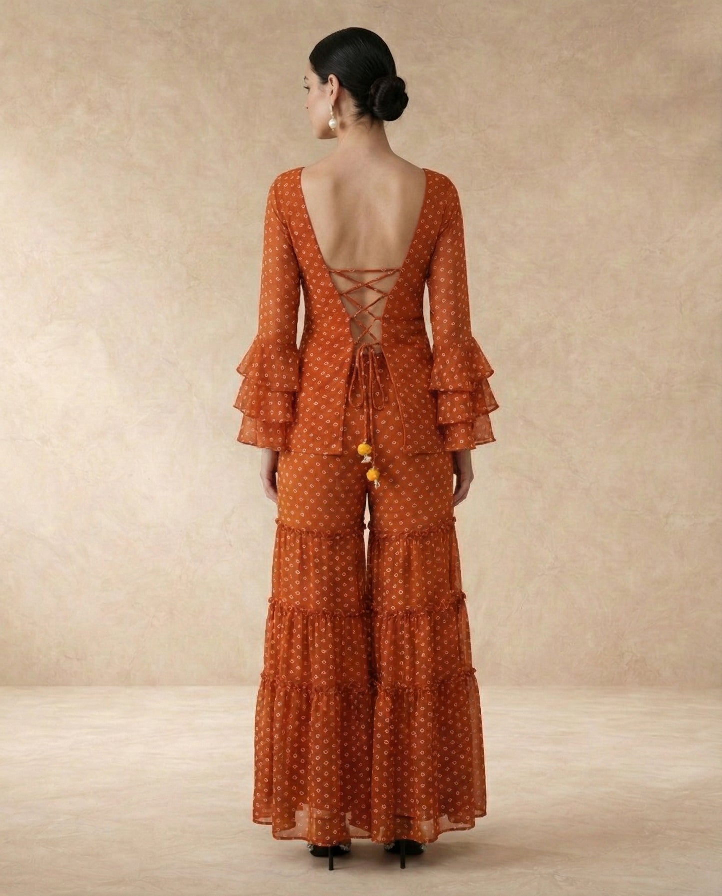 AMBER rust bandhani print sharara set, full-length view.