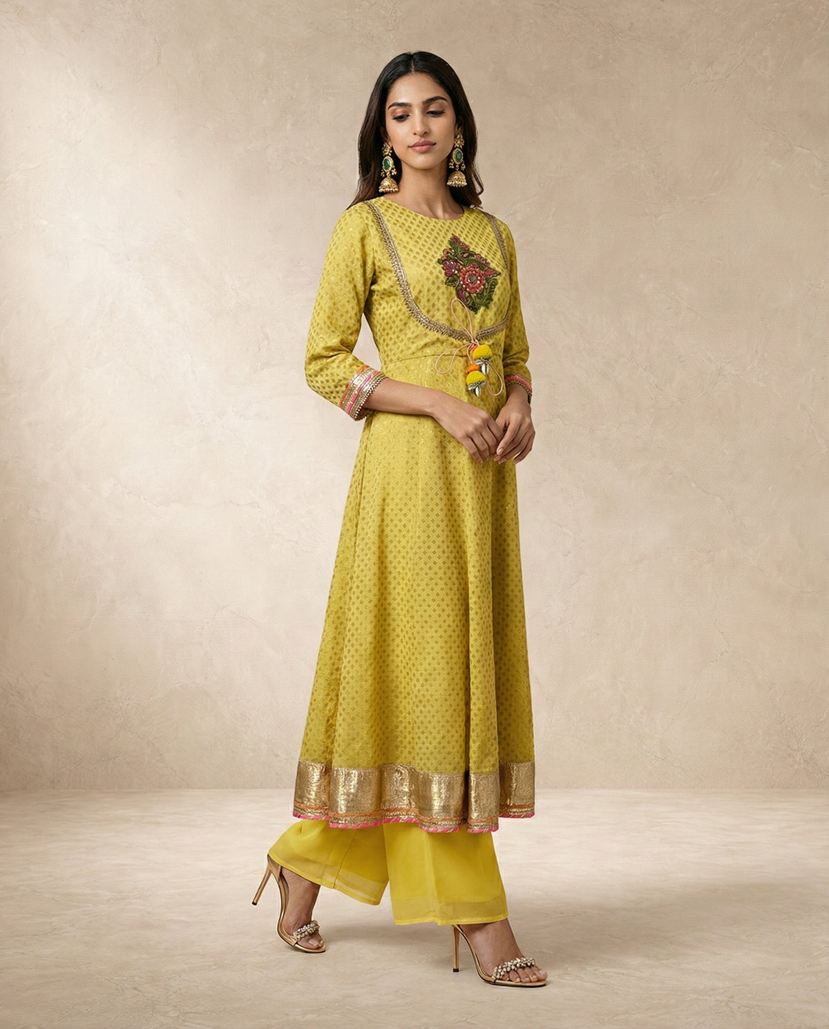 NAZAKAT mustard anarkali with layered gota and lace cuffs by Neha Sharma Label.