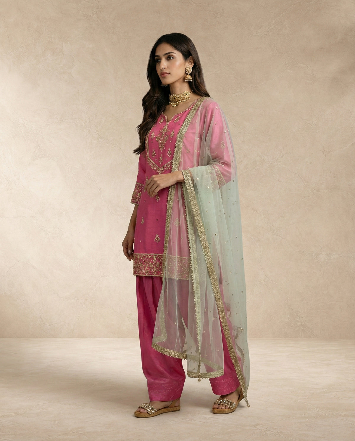 HANIYA pink silk kurta set with embroidered gold hem border by Neha Sharma Label.