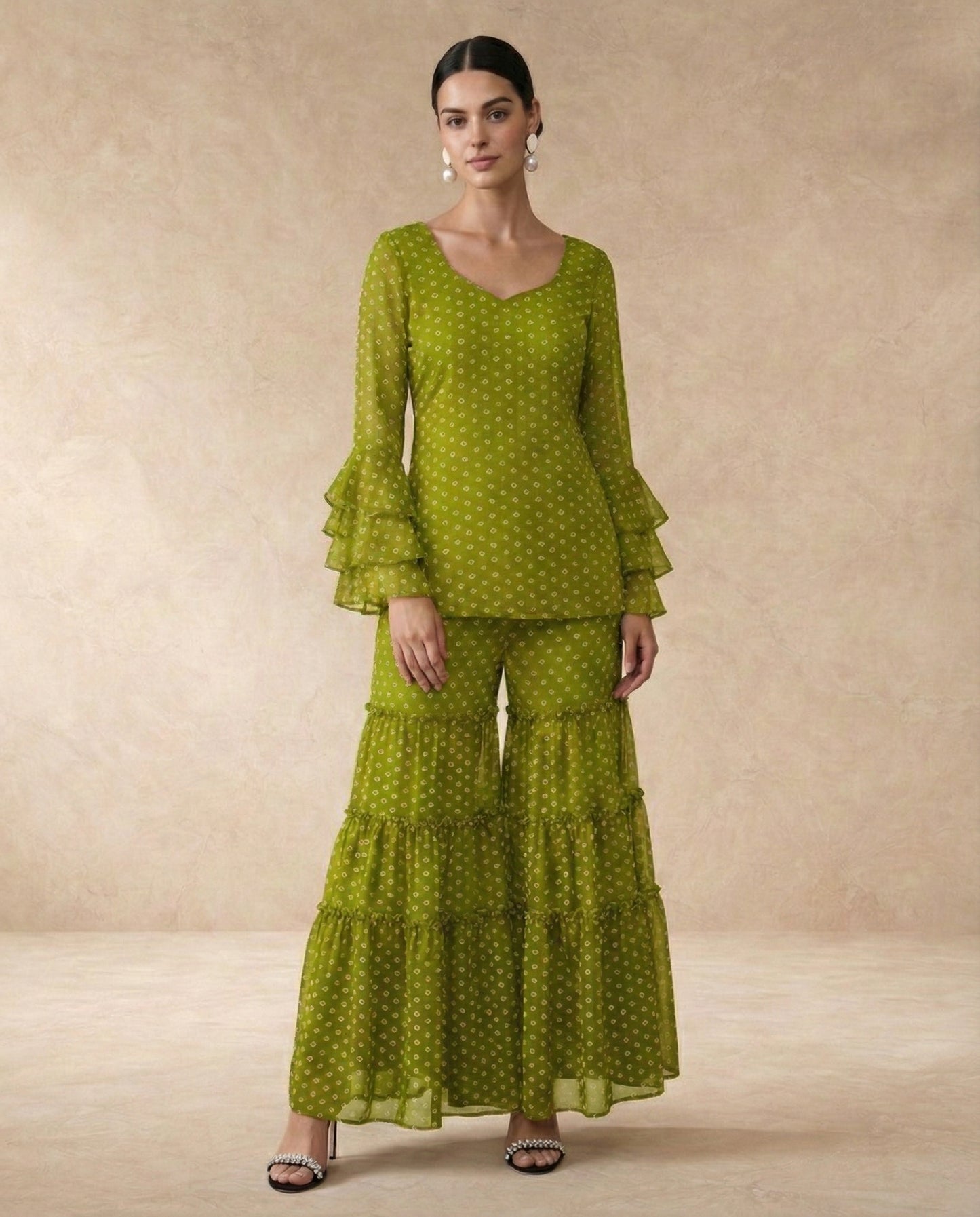 NAVYA green bandhani kurta and tiered sharara styled with the matching dupatta.